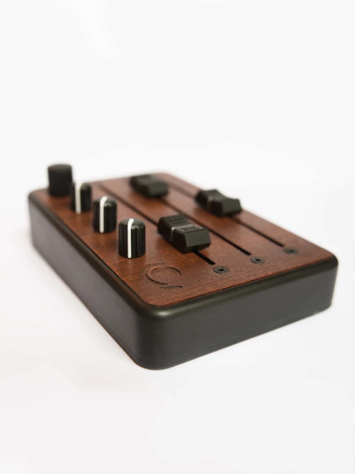 Brise MkII MIDI Controller in three-quarter view, showing its three long faders, knobs and clickable rotary encoder