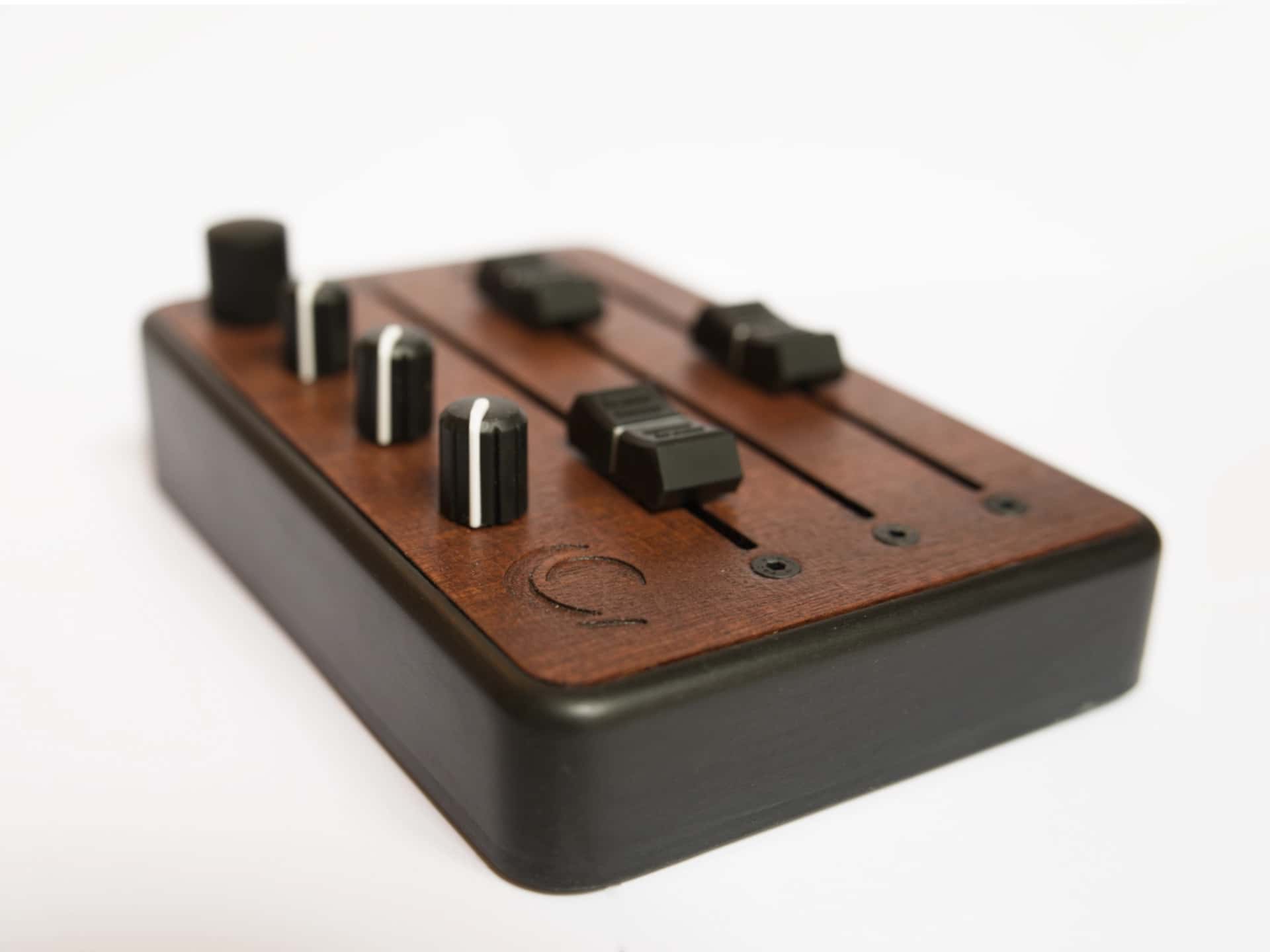 Brise MkII MIDI Controller in three-quarter view, showing its three long faders, knobs and clickable rotary encoder