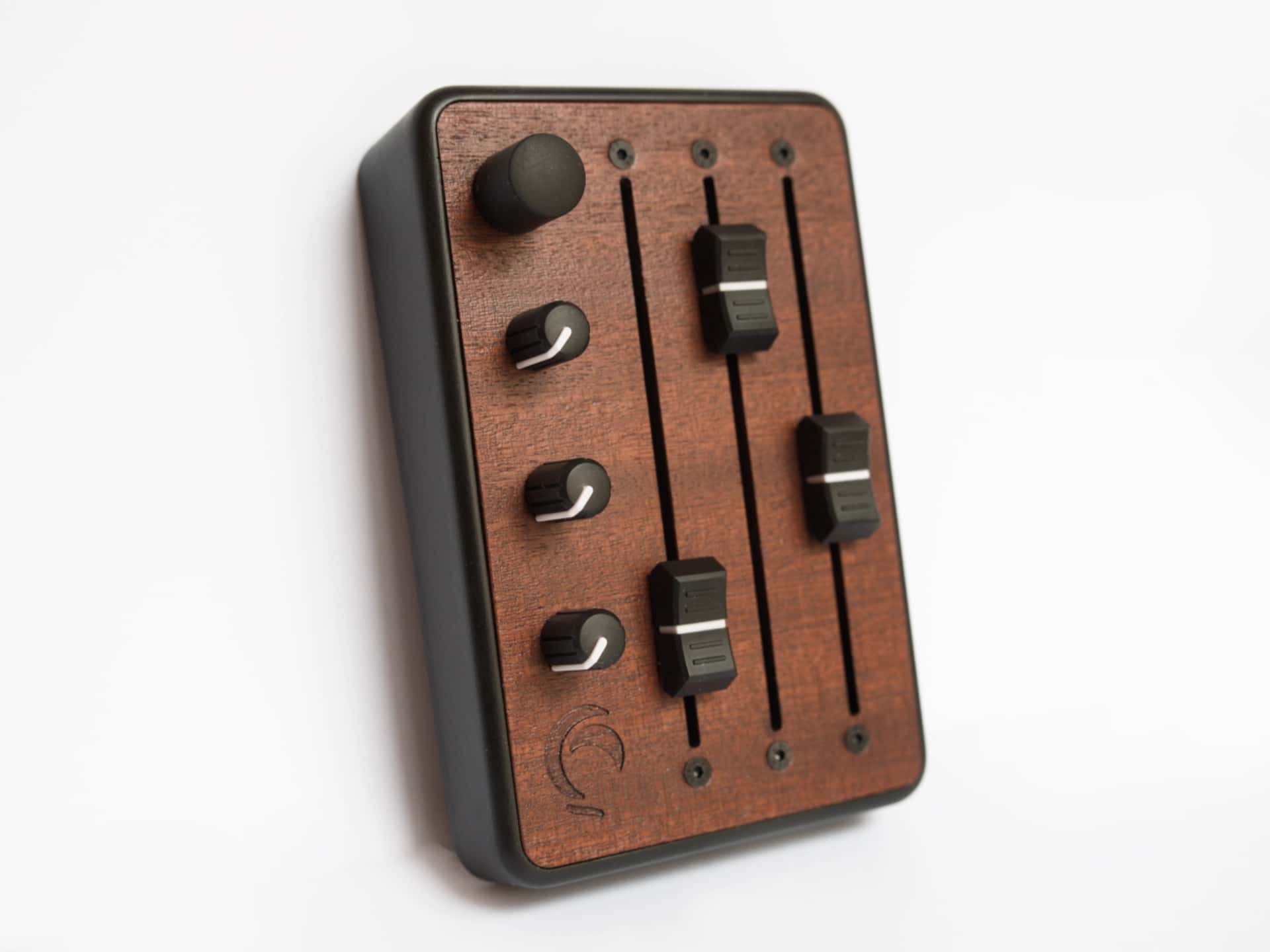 Brise MkII MIDI Controller standing upright, top view of the three 100mm faders, three knobs and the rotary encoder