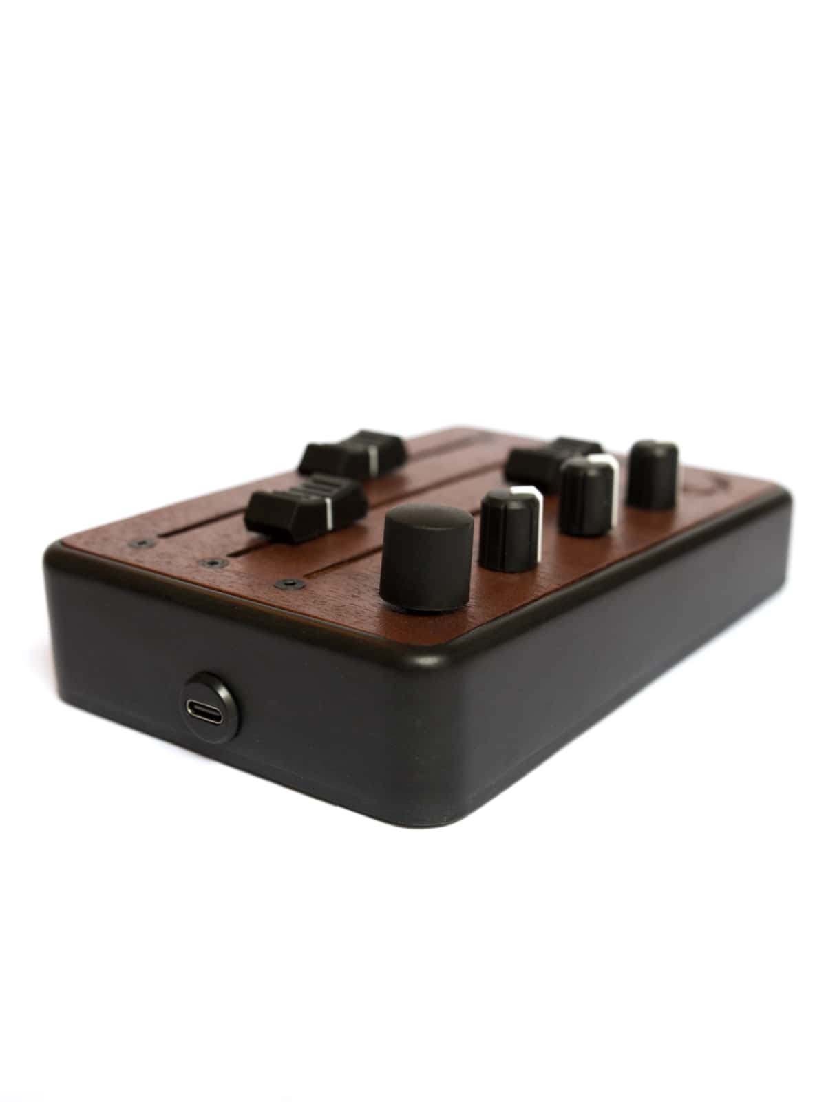 Brise MkII MIDI Controller in three-quarter view, with its USB-C port and rotary encoder
