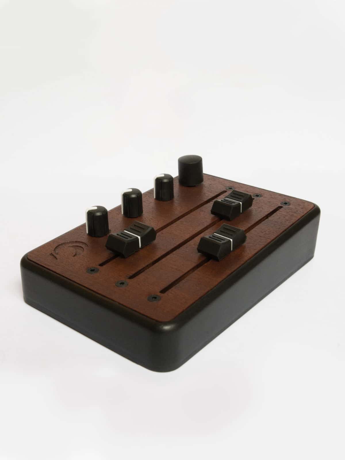 Brise MkII MIDI Controller in three-quarter view from above, with its three faders, knobs and rotary encoder