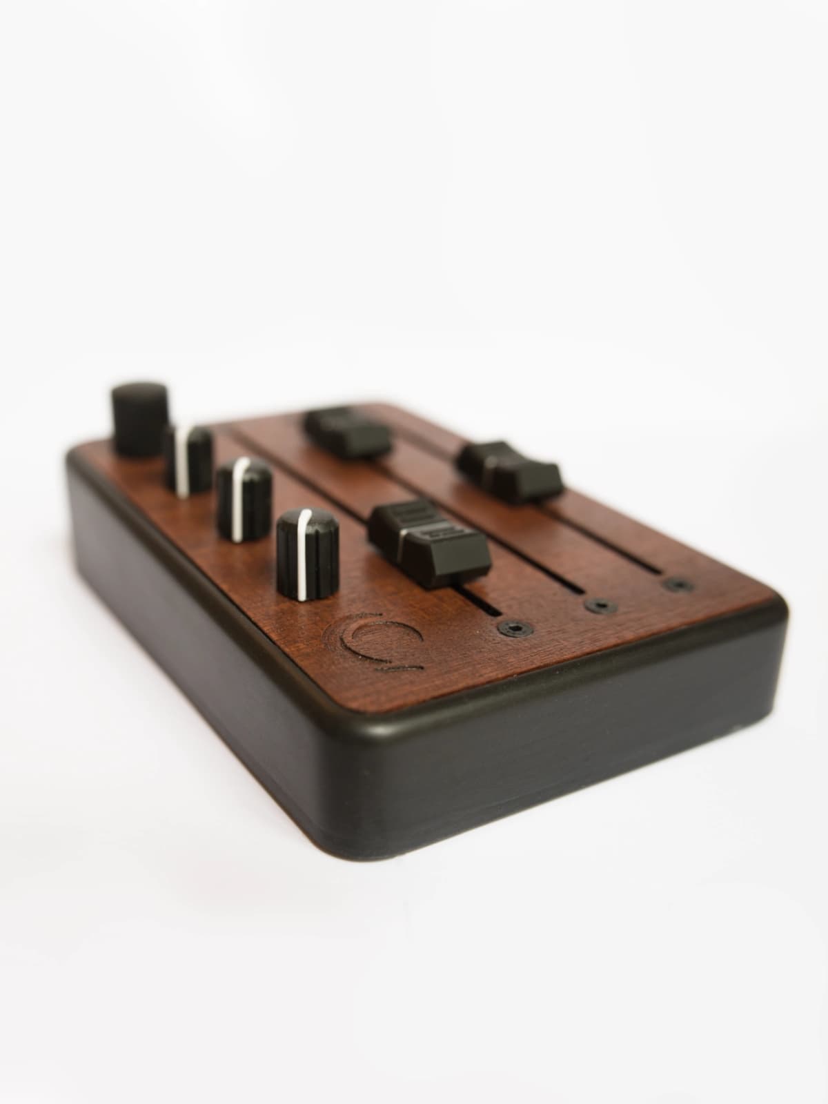 Brise MkII MIDI Controller in three-quarter view, showing its three long faders, knobs and clickable rotary encoder