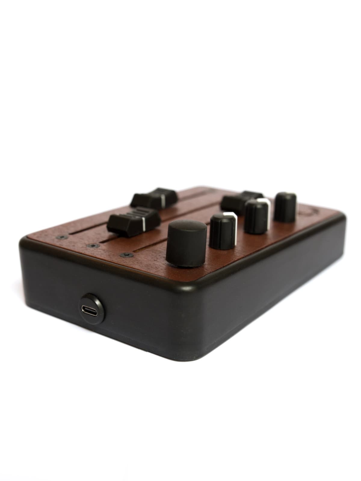 Brise MkII MIDI Controller in three-quarter view, with its USB-C port and rotary encoder