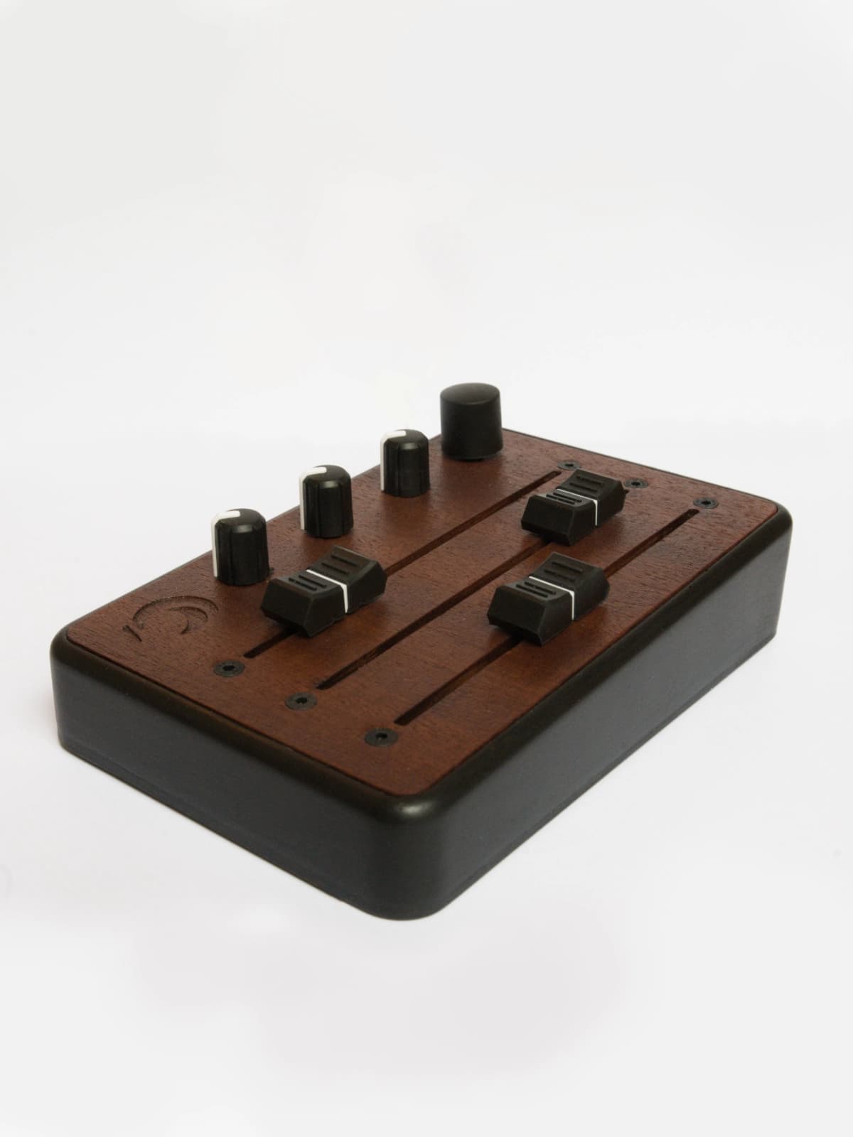 Brise MkII MIDI Controller in three-quarter view from above, with its three faders, knobs and rotary encoder